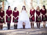 the bride and bridesmaids wearign different brown boots to feel comfortable and cool for a fall rustic wedding