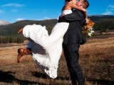 a strapless A-line wedding dress of lace with a draped bodice, brown cowboy boots is a very stylish and cool idea for the fall