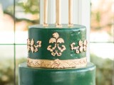 a gorgeous emerald and gold multi-tier wedding cake with refined detailing, with a chic vintage feel is ideal for an elegant or sophisticated wedding
