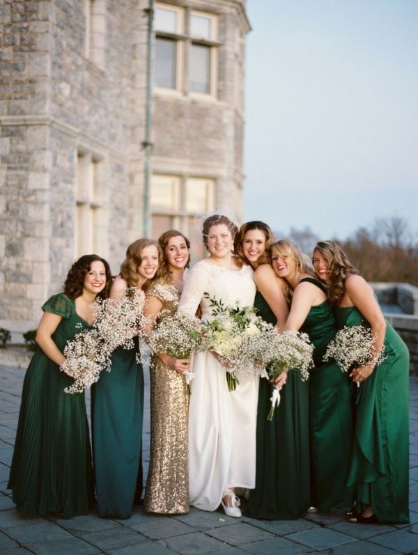 mismatching green and emerald maxi bridesmaid dresses and a gold glitter maxi dress for the maid of honor