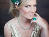 a vintage bridal or bridesmaid look with a gold sequin dress with a deep neckline, emerald jewelry and an emerald feather hairpiece