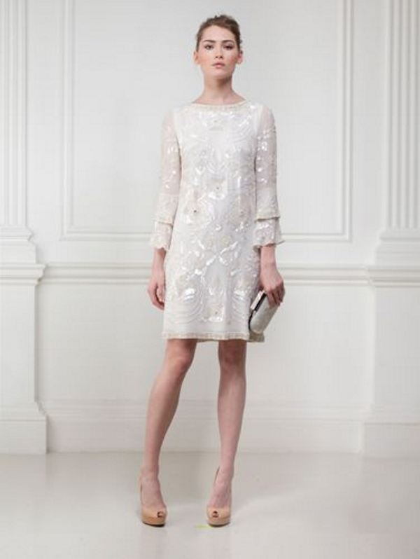 A pretty retro inspired embellished wedding dress with bell sleeves, a high neckline and metallic accessories for a glam look