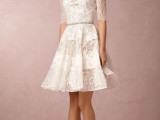 a jaw-dropping lace A-line over the knee dress with strategically placed lace on the bodice and skirt, a high neckline and short sleeves