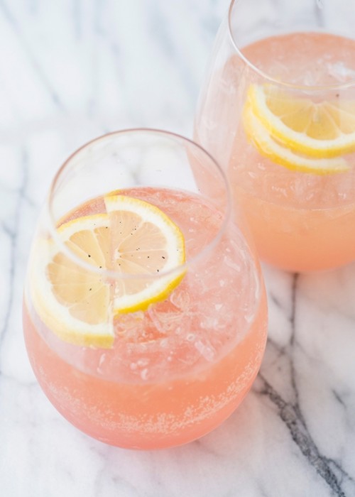 pink lemonade with lemon slices is a gorgeous drink idea for a spring or summer wedding