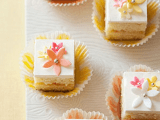 mini cakes with yellow and pink sugar blooms are amazing to serve on your wedding dessert table