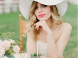 a white vintage wide-brim hat styled as if it’s from the 70s will bring that vintage feel to the look