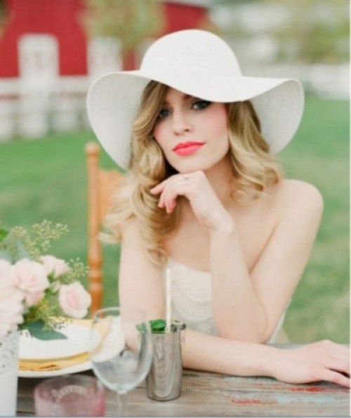 a white vintage wide-brim hat styled as if it's from the 70s will bring that vintage feel to the look