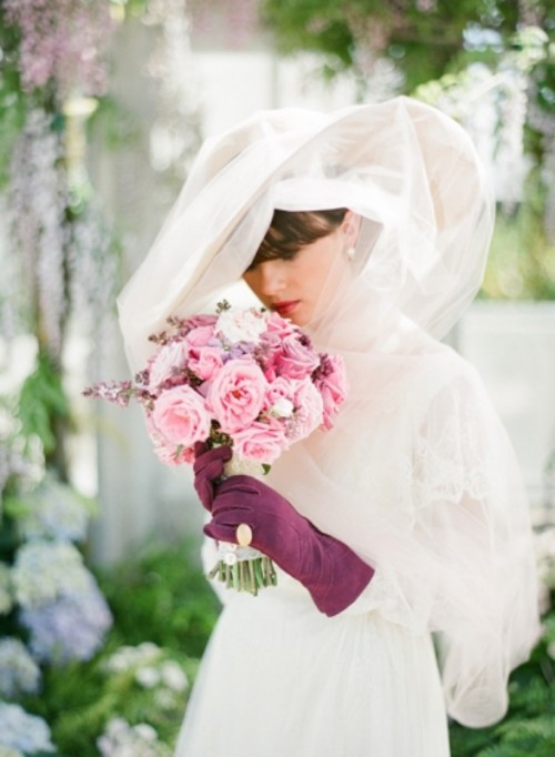 a large white wide-brim hat with a large veil covering it will give you a truly vintage feel