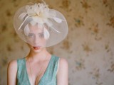 a sheer wide-brim hat with white petals on top is a gorgeous accessory to rock for a vintage bridal look
