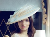 a white wide-brim hat with neutral-colored feathers is a lovely idea for a sophisticated and vintage-inspired bridal look