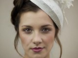 a small and delicate neutral bridal hat with fabric blooms and twigs is a lovely idea for a neutral bridal look