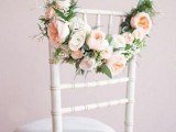 cute wedding chair decor with blooms