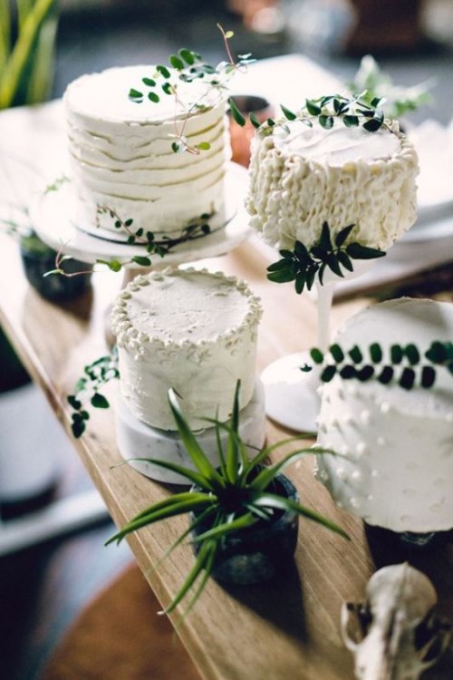 textural small white wedding cakes accented with greenery and leaves for a modern or minimalist wedding