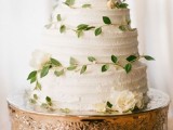 a textural white wedding cake decorated with greenery is a timeless idea for a spring or summer wedding