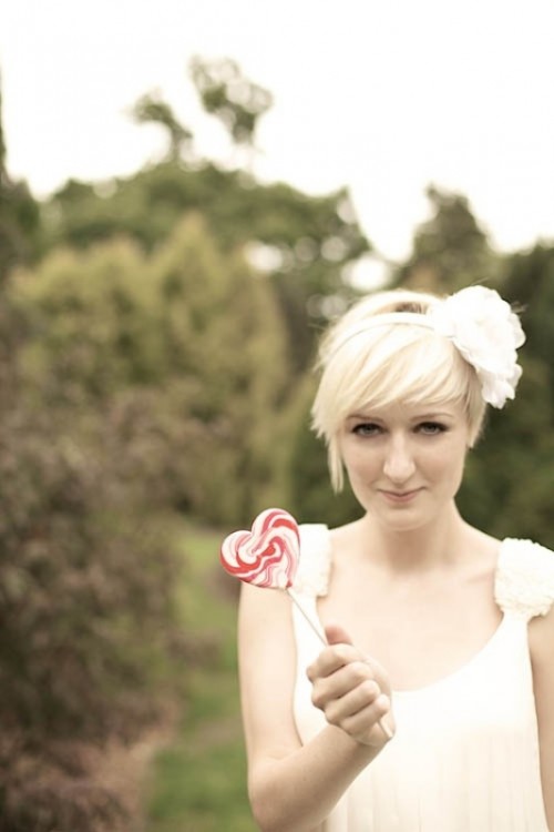 a long blonde pixie accented with a headband with a faux flower is a simple and pretty idea for a wedding