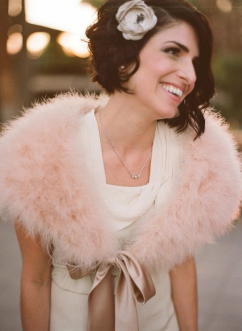 a short and dark wavy bob with a faux bloom as an accent is a beautiful idea for a vintage bride