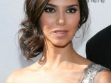 a stylish wavy and twisted side updo with a volume on top is a chic and romantic idea for a gal with medium length hair