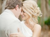 a messy wavy and curly side updo with a volume on top is a more relaxed type of hairstyle for an effortless bride