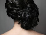 a curly twsited and wavy side updo with a volume on top for long hair and a romantic vintage bridal look