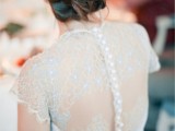 a white wedding dress with powder blue lace detailing is a chic and very sweet idea to go for