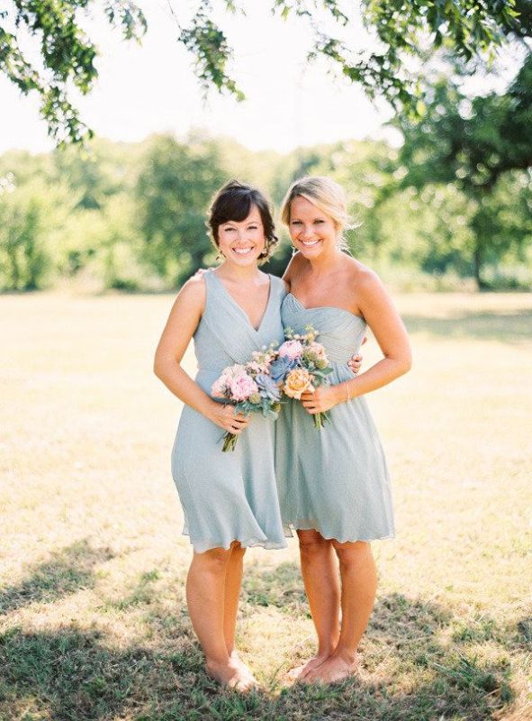 Mismatching knee powder blue bridesmaid dresses paired with neutral shoes are perfect for spring and summer