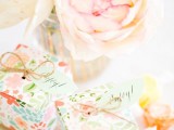 a gorgeous lush pastel bloom party centerpiece and some packed gifts