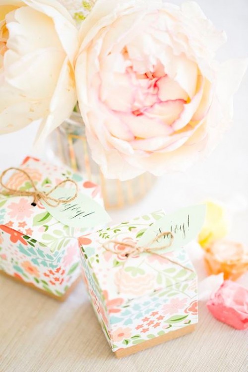 a gorgeous lush pastel bloom party centerpiece and some packed gifts