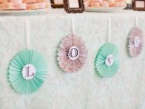 pastel-colored vintage paper fans can be used for backdrops or to decorate a dessert table