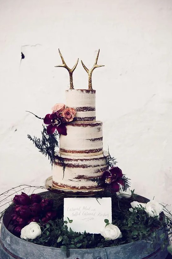 a couple of fake gilded antlers are great for a boho or woodland winter wedding cake and look unusual