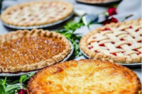 an assortment of delicious pies are a nice alternative to a usual wedding dessert table and will give a homey feel to the wedding
