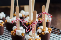 chocolate popsicles with nuts and marshmallows on top are delicious and scream Christmas with their look