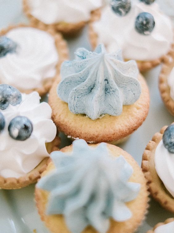 cool tartlets with icy blue topping and blueberries are a delicious idea for a Frozen-inspired wedding