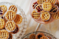 mini pies instead of usual cupcakes are a veyr cozy and homey idea for a winter or even fall wedding with a rustic feel
