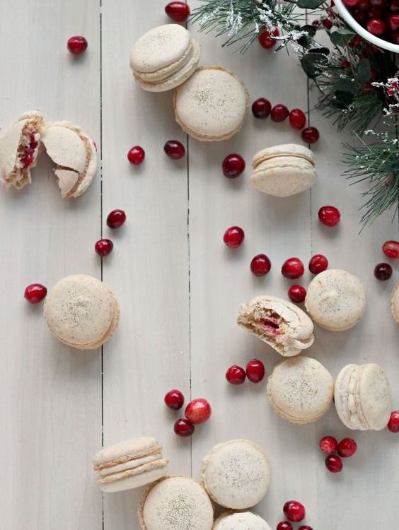 orange walnut macarons with spiced cream cheese and cranberry filling for a winter dessert table