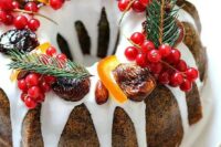 poppy seed bundt wedding cake with white chocolate drip, cranberries, evergrenes, cinnamon and candied fruit