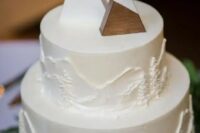 wooden triangles showing off snowy mountains are perfect for a mountain wedding, not only in winter