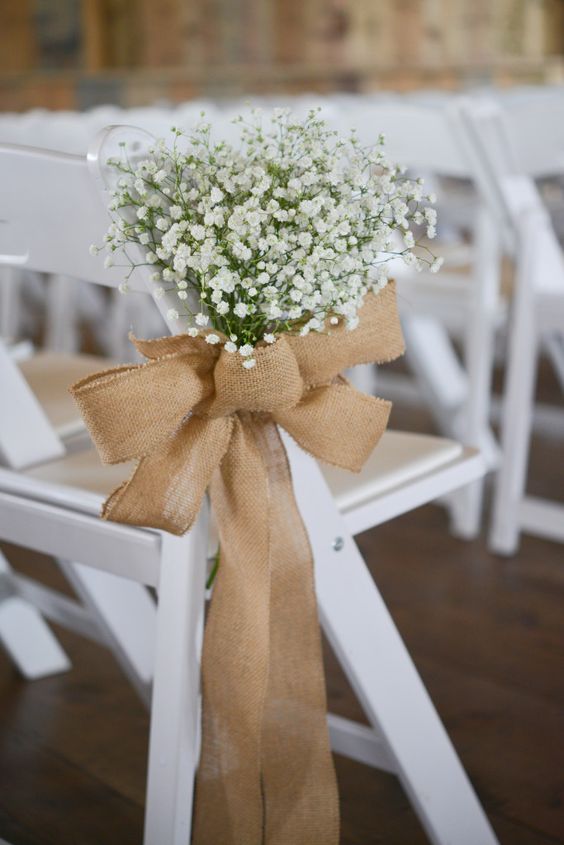 a burlap bow with baby's breath is a stylish wedding decor idea, it will give a rustic feel to the space