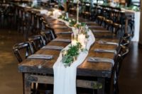 long rustic wedding table with a white runner