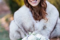a grey faux fur stole is an elegant choice that will easily match many bridal looks, styles and color schemes of your outfit