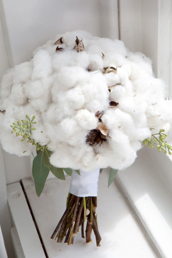 a lush cotton bouquet with some greenery reminds of fluffy snow or a fluffy cloud