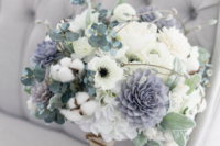 a pale winter wedding bouquet in white and grey, with cotton and eucalyptus