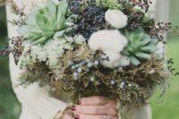 a textural bouquet with cotton, succulents, privet berries and foliage and greenery