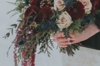 bouquet with hanging burgundy amaranthus, pomponis, silver brunia, thistles, blush roses and winter foliage