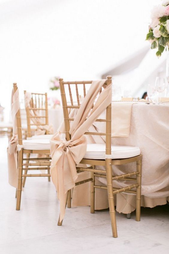 chic blush fabric chair decor with large bows is a lovely idea for a wedding, they will add a refined touch to the wedding reception