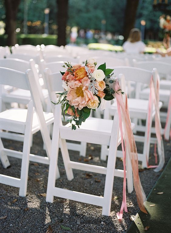 colorful and pastel ribbons and a lush floral decoration for wedding chair decor, they will add a touch of color