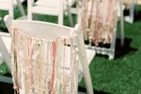 colorful ribbon hanging on the chairs will give a festival and fun touch to the space, whether it’s a reception or a ceremony space