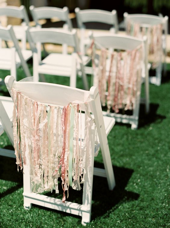 colorful ribbon hanging on the chairs will give a festival and fun touch to the space, whether it's a reception or a ceremony space