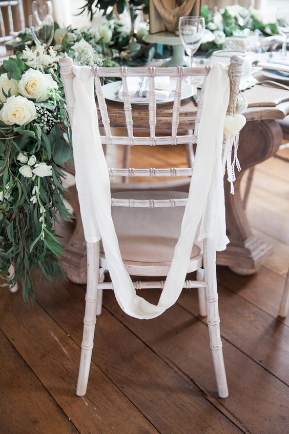 elegant and flowy white ribbons, white hearts and beads are pretty and cool for a neutral wedding, this decor is easy to recreate