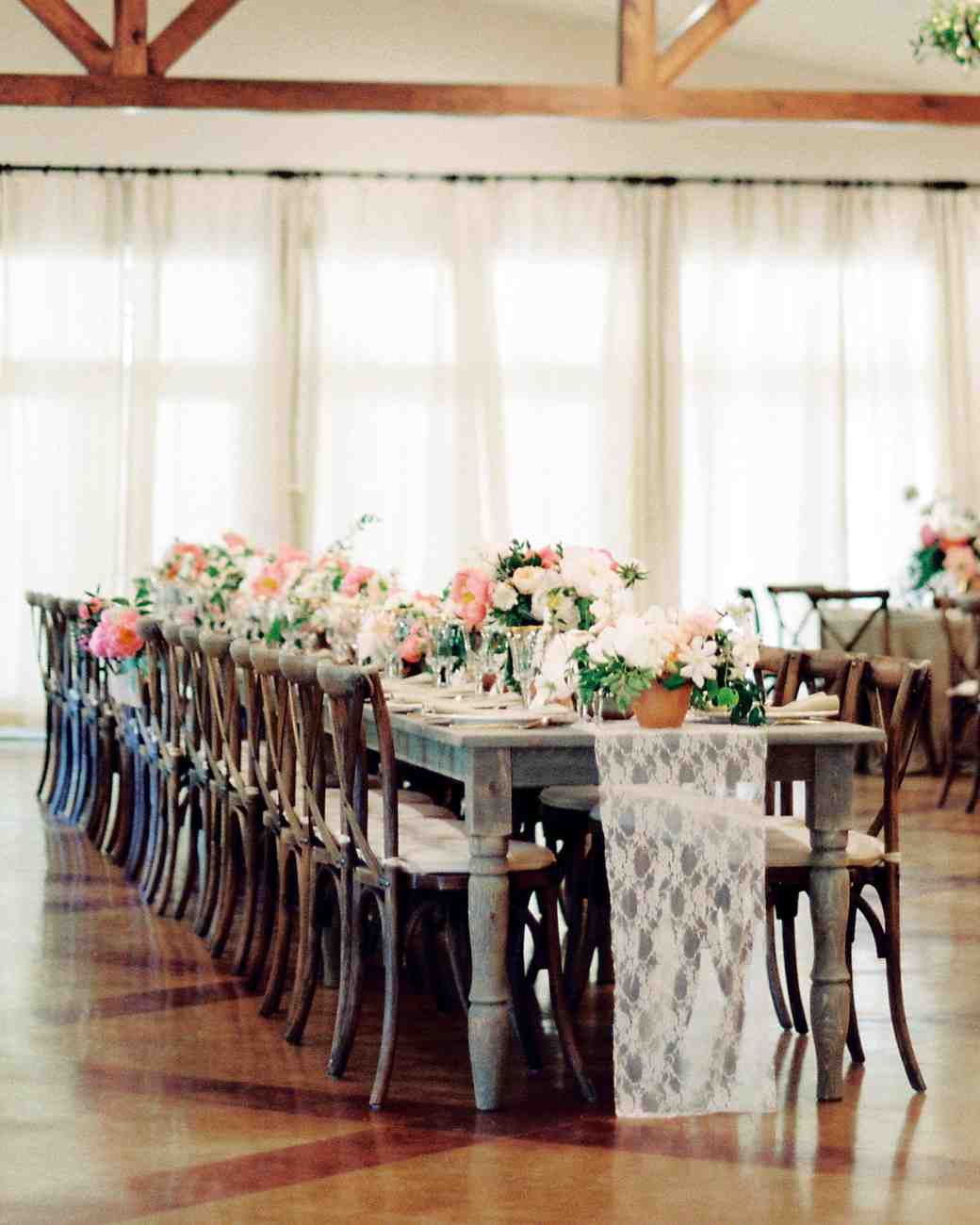Lace and peachy pastels softened up the rustic weathered tables