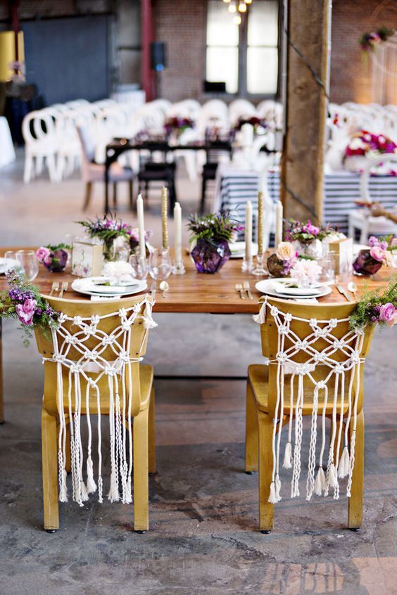 macrame hangings, bright blooms and greenery are amazing for styling wedding chairs for a boho wedding